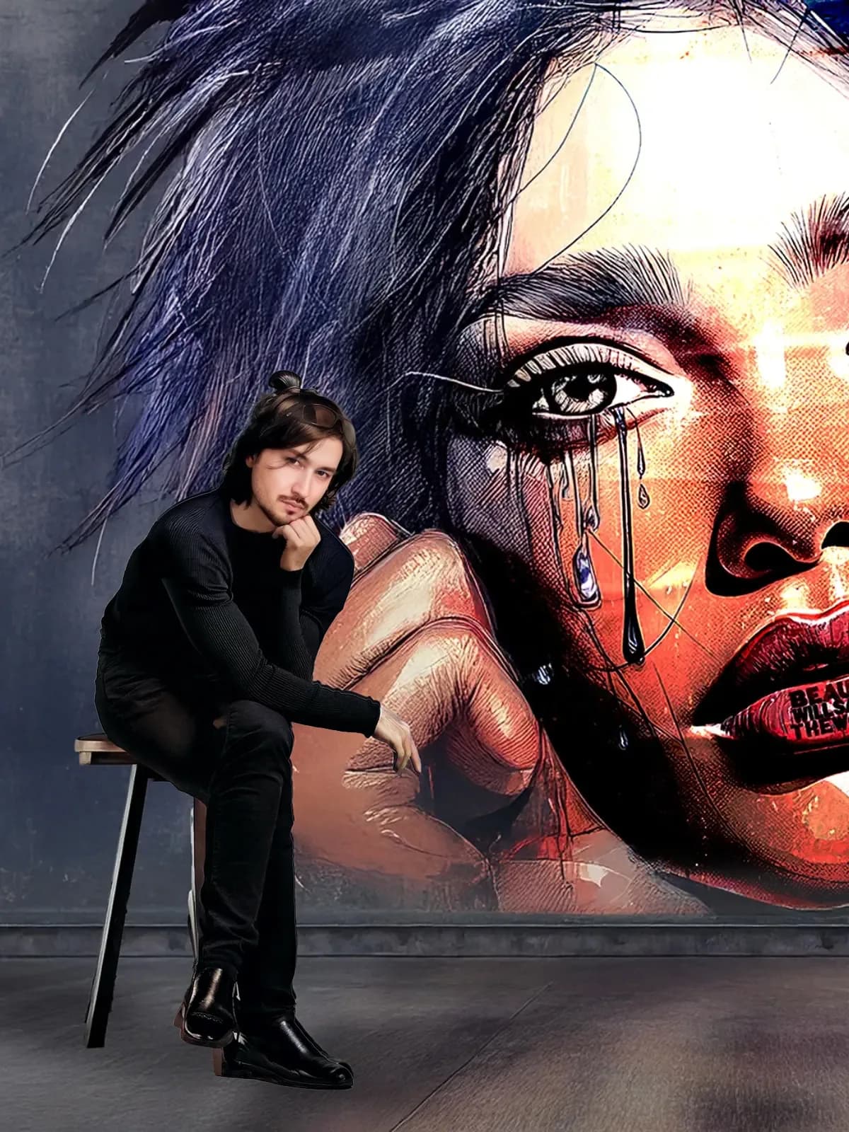 Miiyoo seated in front of a wall-sized portrait from the Visages series