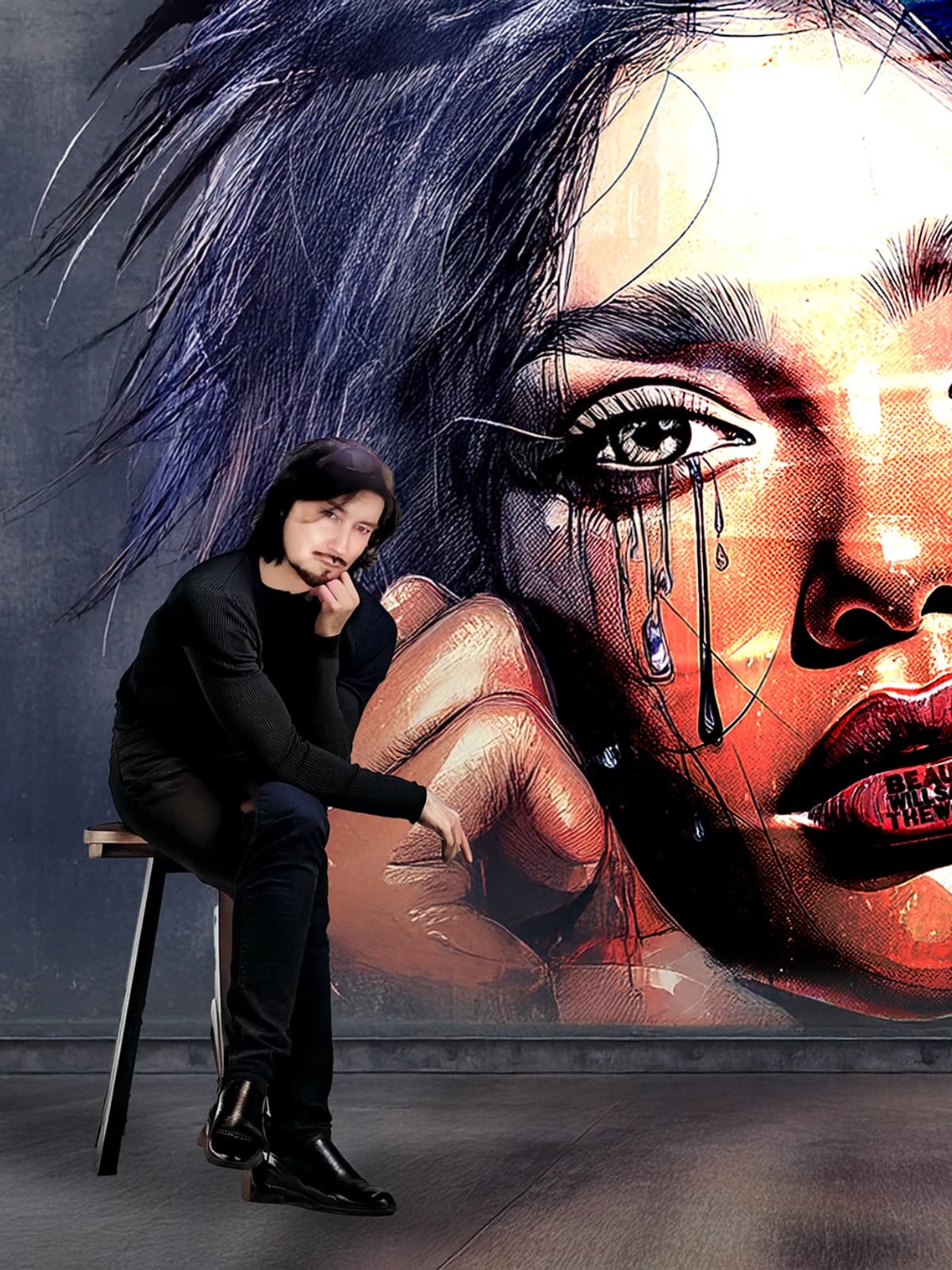 Miiyoo seated in front of a wall-sized portrait from the Visages series